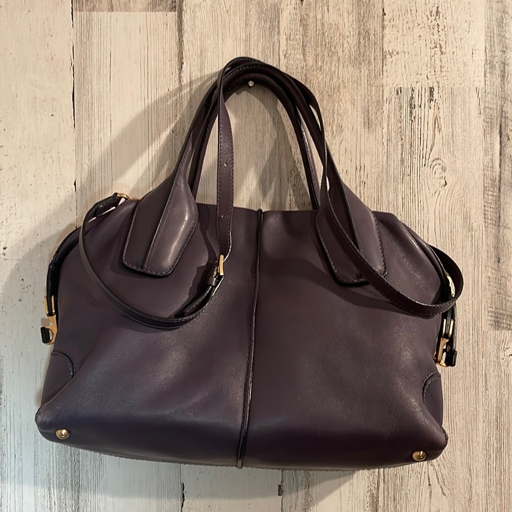 Tod’s purplish-gray Bauletto bag with top handles and cross-body strap